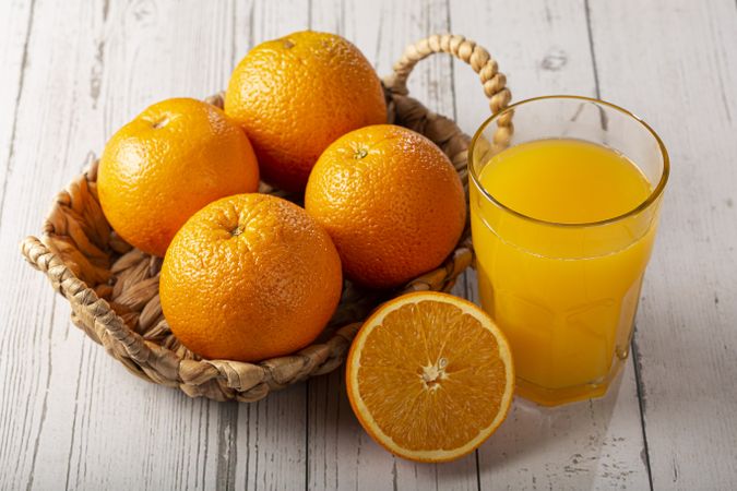 Glass with orange juice on the table.