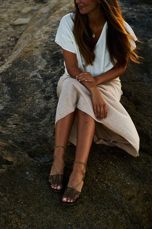 young woman posing on rock