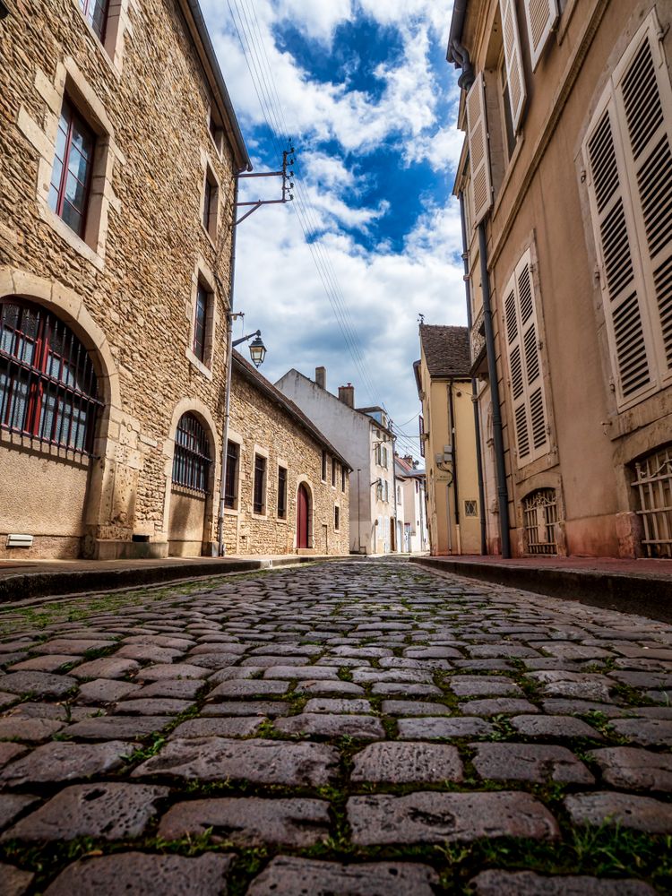 Empty streets of the medieval city of Beaune in Burgundy. The stormy sky