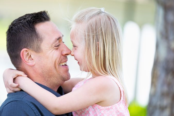 Young Father and Daughter Having Fun At The Park