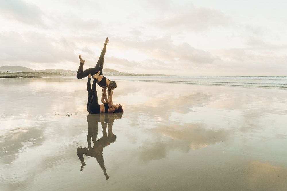 Women exercising near sea