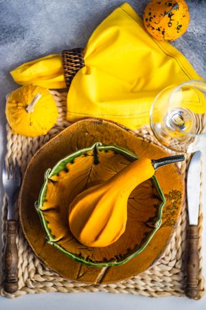 Top view of orange autumnal squash in orange bowl