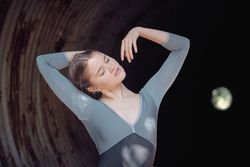 Graceful ballerina in old tunnel