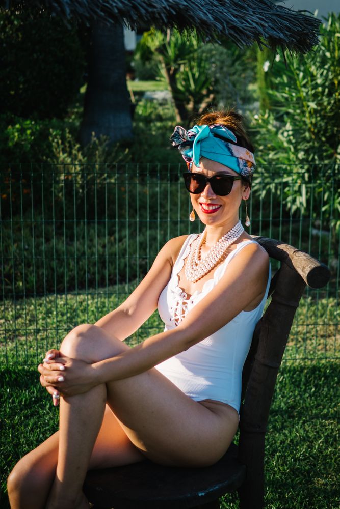 Young elegant Chinese woman sunbathing