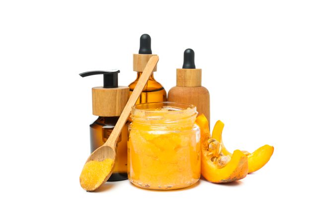 Concept of different cosmetic products, Pumpkin cosmetics, isolated on light background