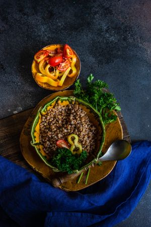 Top view of bowl buckwheat and mini peppers