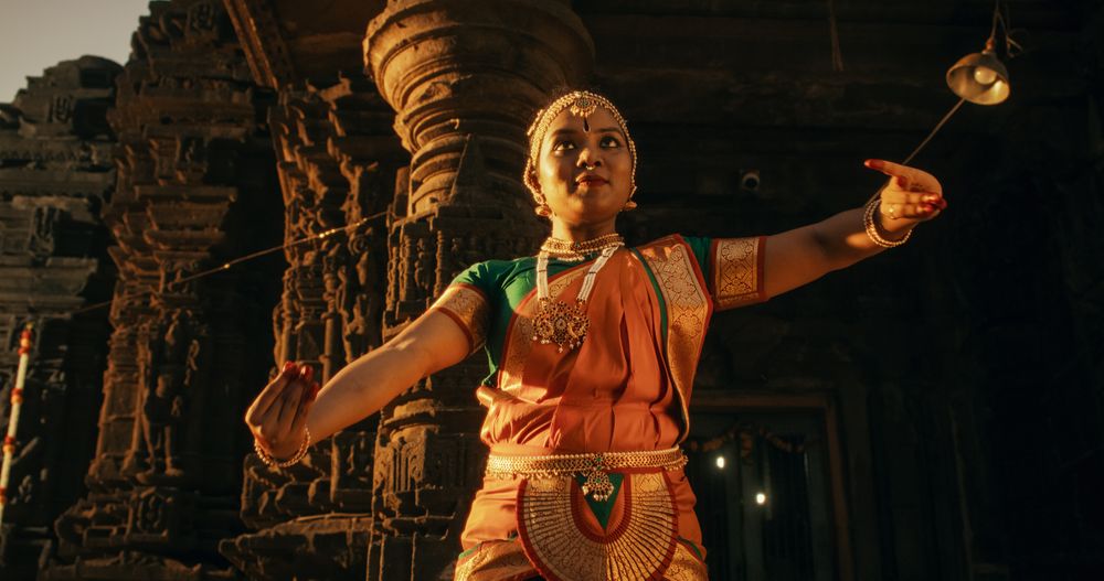 Portrait of Energetic Group of Indian Women Joyfully Dancing Traditional Folk Dance Inside an Empty Historical Temple.