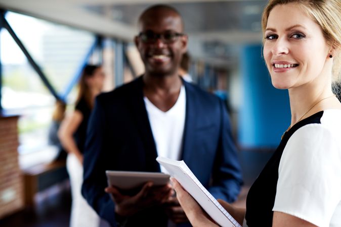 Happy male and female business leaders