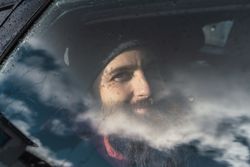 Smiling man sitting in car