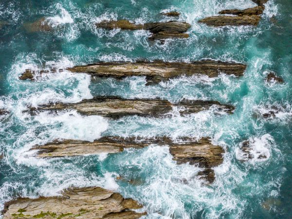 Stone ridges on high seas in stormy day