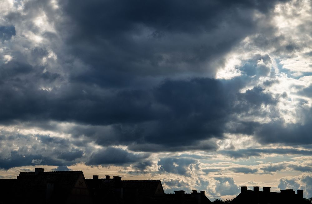Fluffy clouds over rooftops