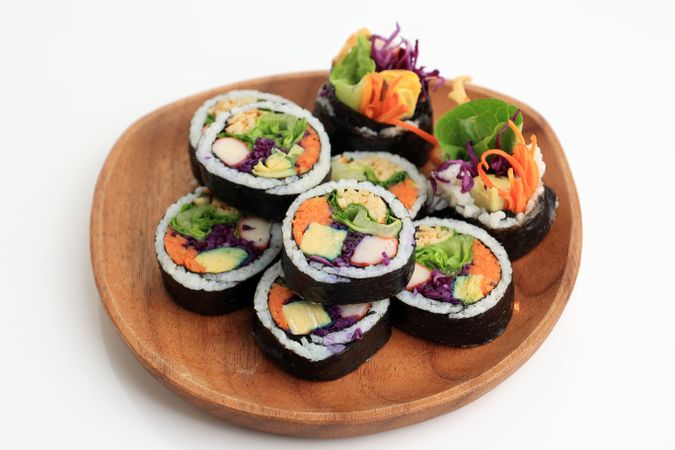 Kimbap, Korean Roll Rice with Nori Laver, Egg, Crab Stick, Carrot, Lettuce, and Purple Cabbage