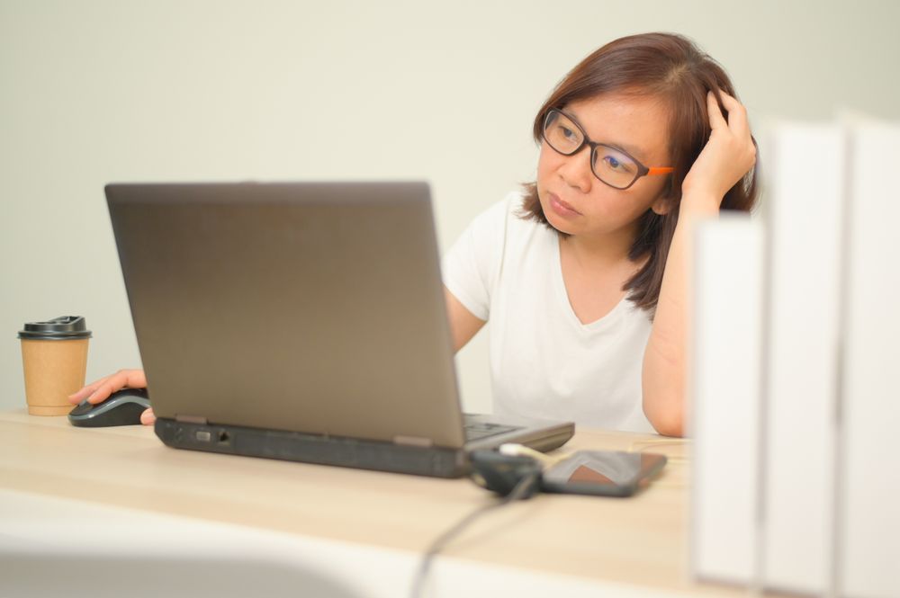 A woman working from home with a laptop.