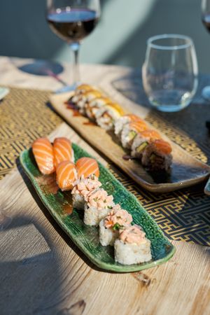 Appetizing Asian sushi on plate served on table