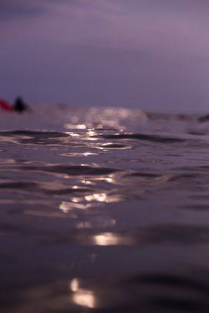 Water wave and cloudy sky