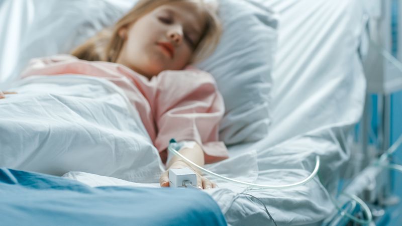 Cute Little Sick Girl Sleeps on a Bed in the Children's Hospital