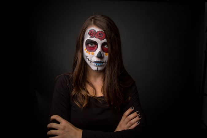 Young woman with creepy face paint