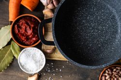 Top view of fresh ingredients for dinner surrounding pan