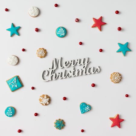 Christmas cookies and red berries with “Merry Christmas” text