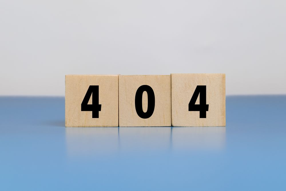 404 not found error code on wooden blocks isolated on blue and blank background