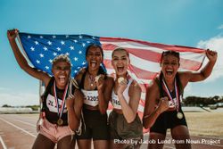 Group of female runner with medals winning a competition 0KBlzb