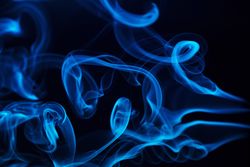 Colorful smoke on dark background