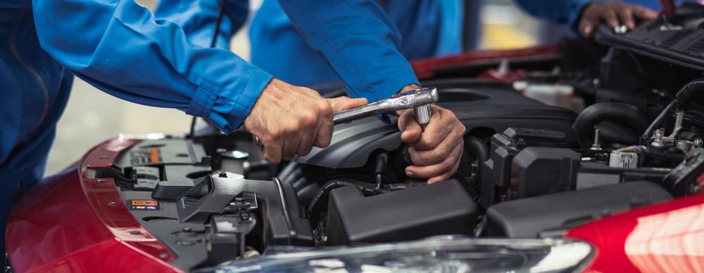Banner of automobile mechanic and team checking under car bonnet