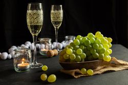 Glasses with wine and grapes