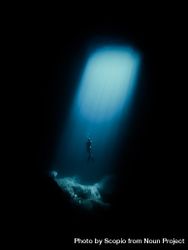 Underwater shot of Person diving in ocean depth 5ryDl0