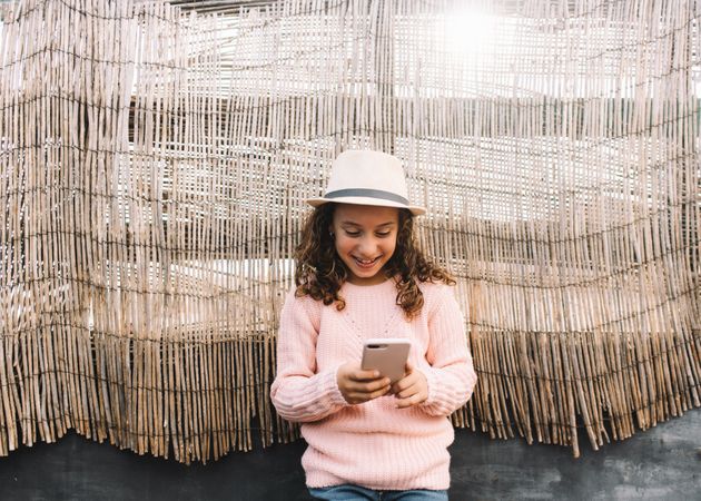 Focused girl using smartphone in countryside