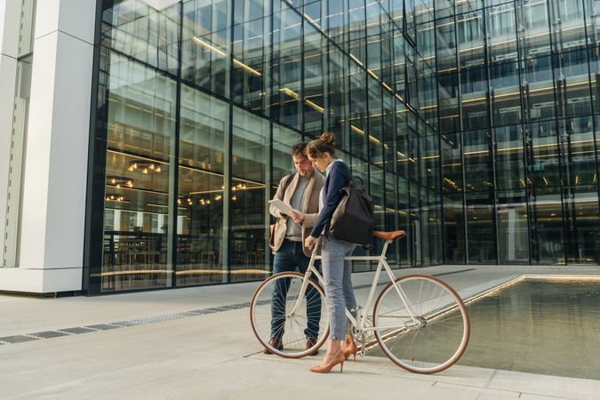 Businesspeople talking on street after work