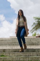 Woman in warm clothes walking down stone stairs