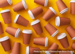 Scattered disposable coffee cups on yellow background 4Bg2db