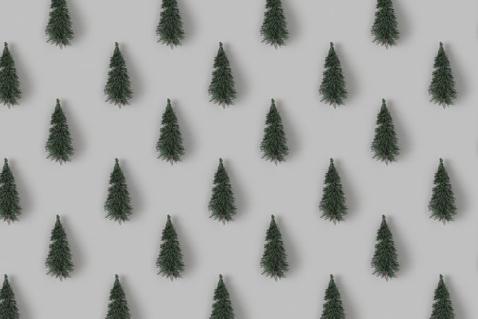 Holiday pattern with Christmas trees on gray background