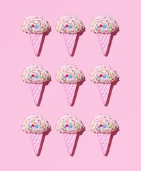 Cute ice cream cone toys on pink background