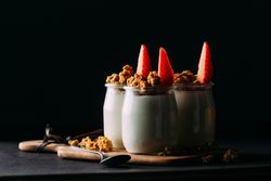 Glass bottles with milk and walnuts