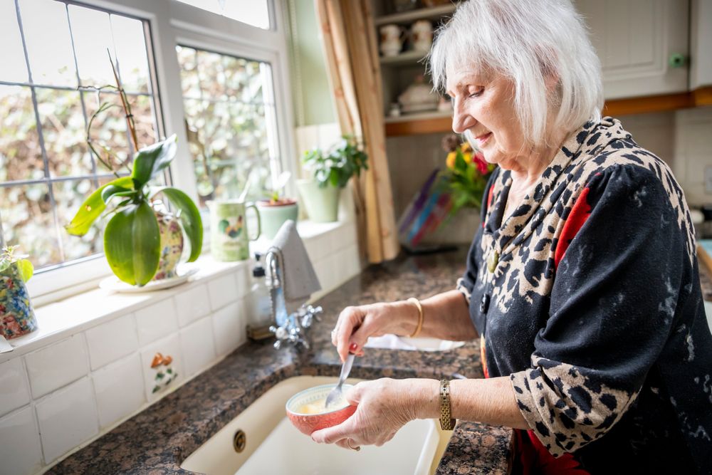 Woman with bowl in kitchen