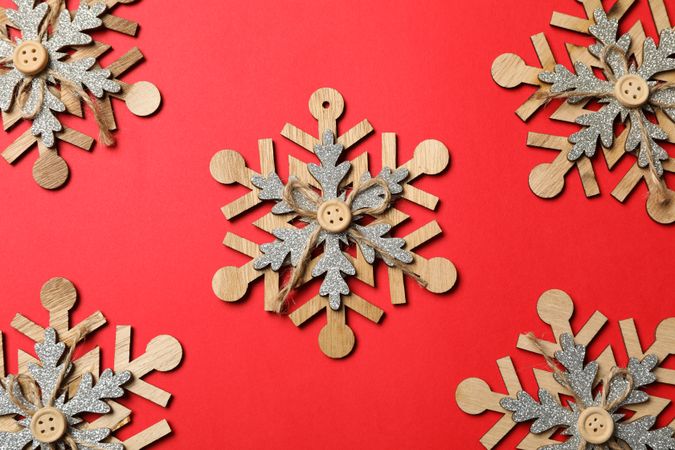 Decorative snowflakes on red background, space for text