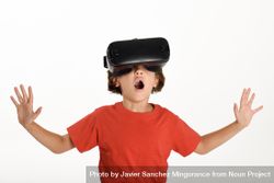 Smiling girl excited by VR glasses and gesturing with arms opened 5oJxQ0