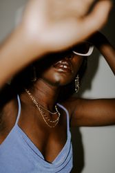 Black woman wearing framed sunglasses