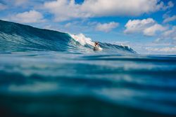 Person surfing sea waves