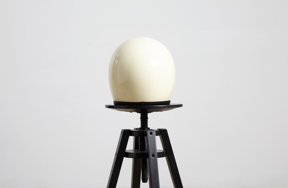 Rear view of motorcycle helmet on a stool