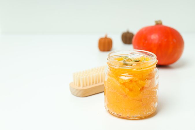 Skin care and face care concept - pumpkin cosmetic