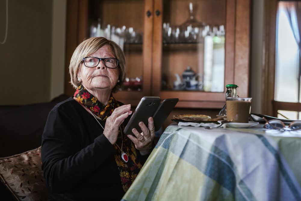 Mature woman looking in smartphone