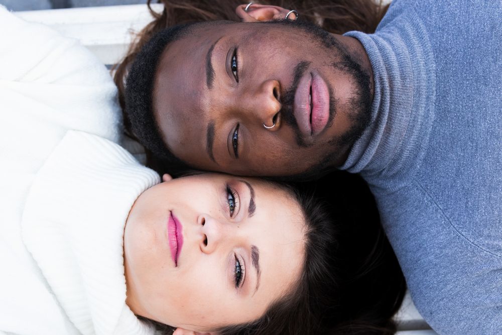 Loving multiethnic couple resting together