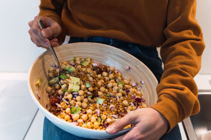 Black woman eating healthy salad