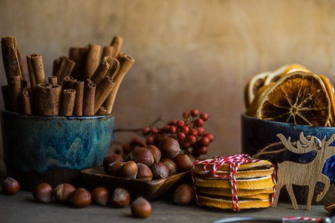 Side view of Christmas food concept or dried slices, nuts and cinnamon