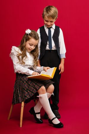 Schoolchildren in uniform with book