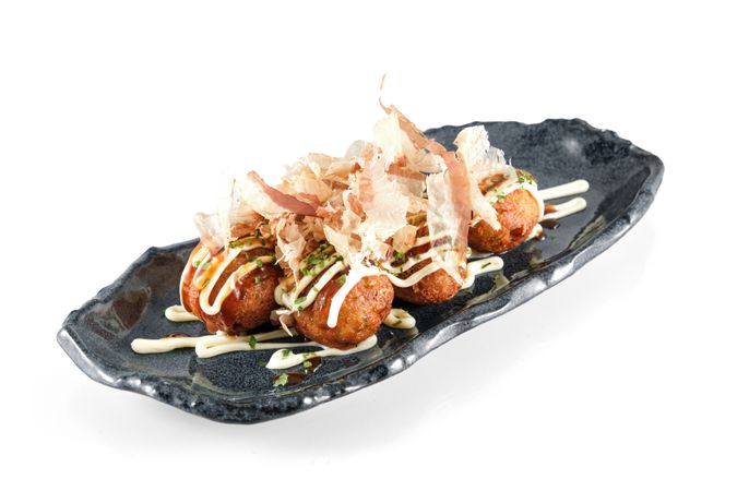 Served Takoyaki balls with sauce