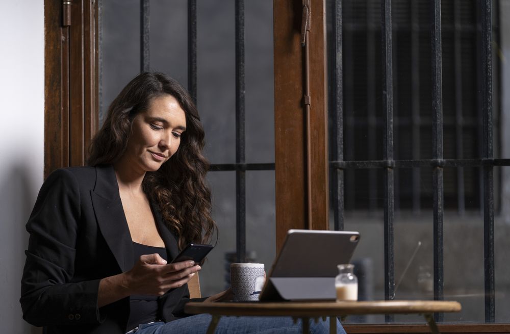 Young female using a mobile phone in cafe